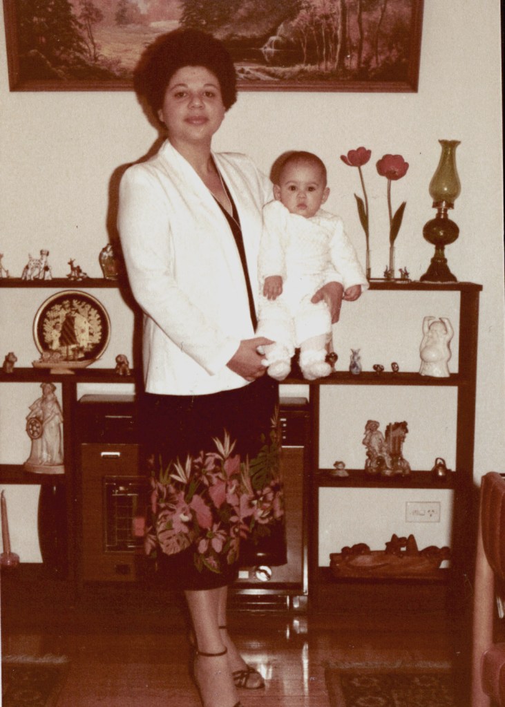 This is my favourite photo of my Mum and I when I was a baby.  What a spunk and I love how proud she her stance is and her beautiful skirt. 